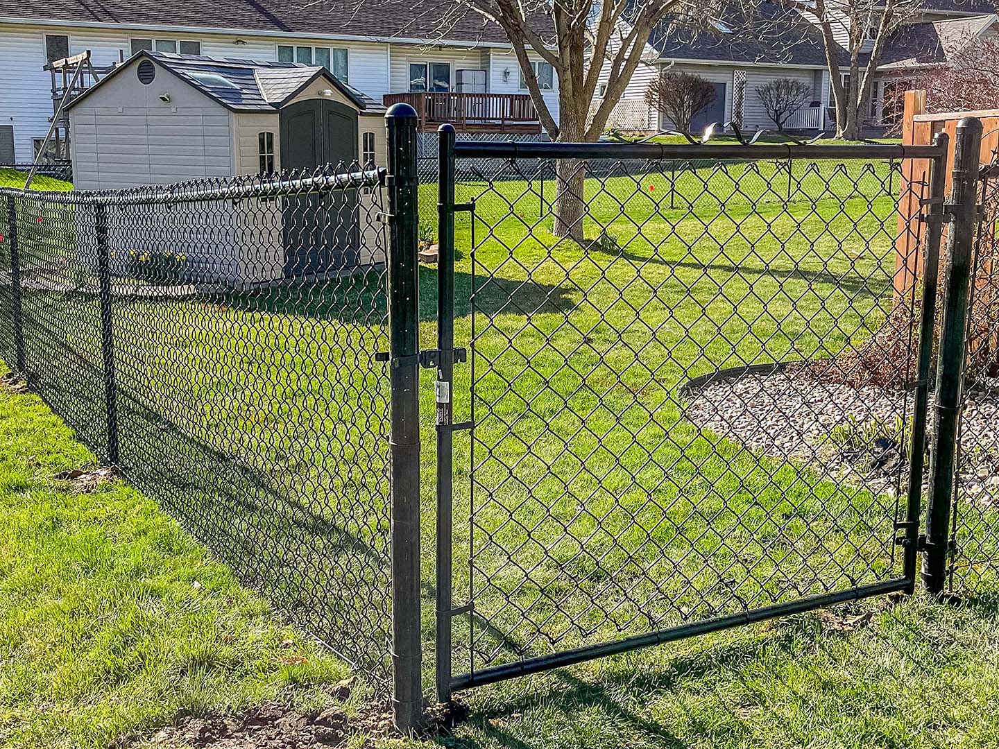 Residential 4' black chain link fence and gate in Cedar Falls Iowa