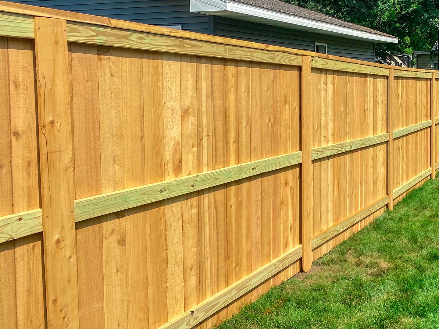 Residential full privacy wood fence with cap and trim in Cedar Falls Iowa